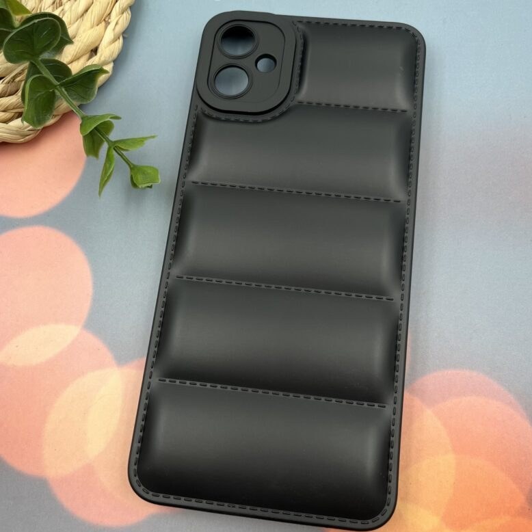 qXyIxUDAI18lcrt6 قاب گوشی Galaxy A05 سامسونگ سیلیکونی پافری برجسته طرح ساده محافظ لنز دار مشکی کد 48992